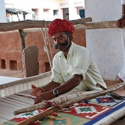 India Textiles Tour artisans hand weaving dhurrie rugs